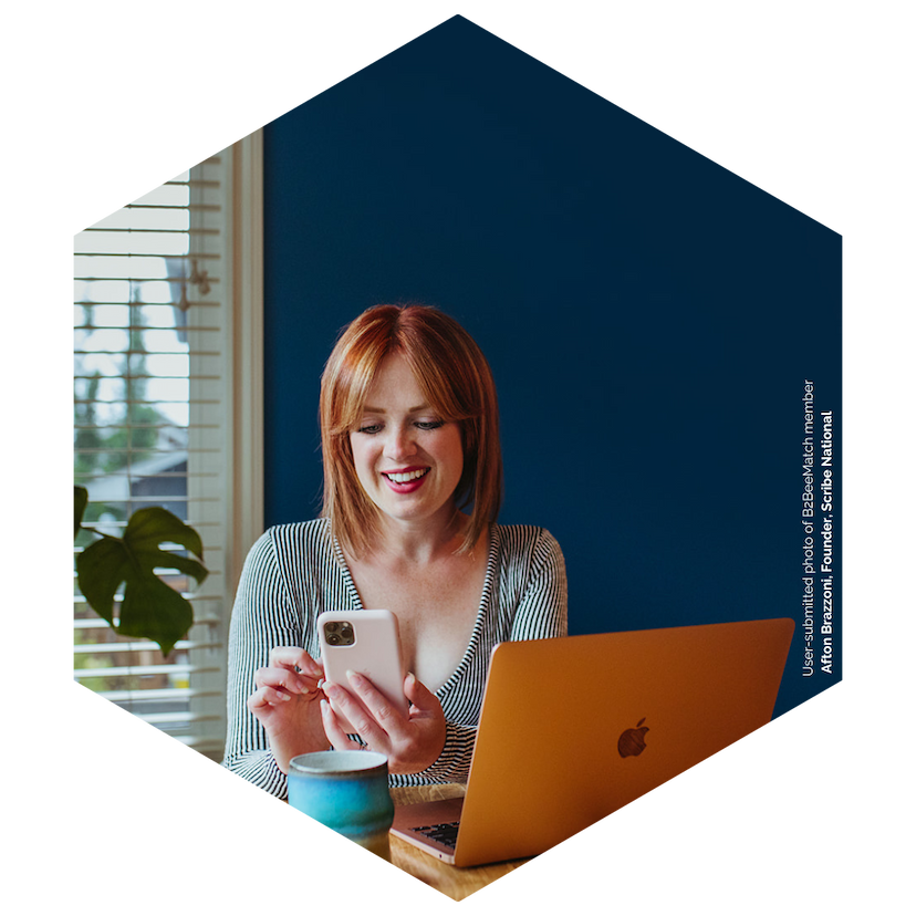 Afton Brazzoni, B2BeeMatch member, scrolls on her cell phone.