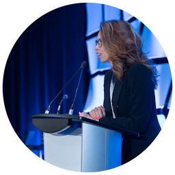 Natasha Gagnon, B2BeeMatch partner, addresses a B2B business networking event for the aerospace sector wearing black.